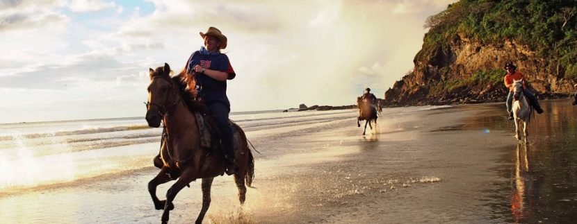 Big Sky Ranch horses galloping on the beach