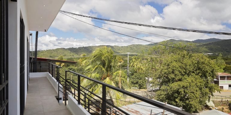 Multiunit Apartment Building in Town - San Juan del Sur - Invest Nicaragua - 2_Bedroom_Apartment_Top_Floor_Left_Side_Patio_Exterior_View_CC