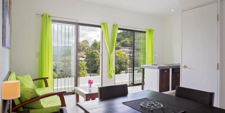 Multiunit Apartment Building in Town - San Juan del Sur - Invest Nicaragua - 2_Bedroom_Apartment_Top_Floor_Right_Side_Dining_Living_Area_Partial_Kitchen_CC