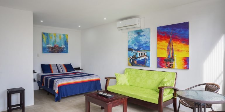 Multiunit Apartment Building in Town - San Juan del Sur - Invest Nicaragua - Studio_Apartment_Living_Area_Bedroom_CC