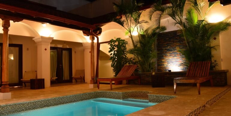 Beachfront Hotel - Pool lit at night